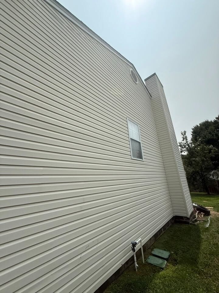 Long run of house siding after washing, clean and evenly coloured