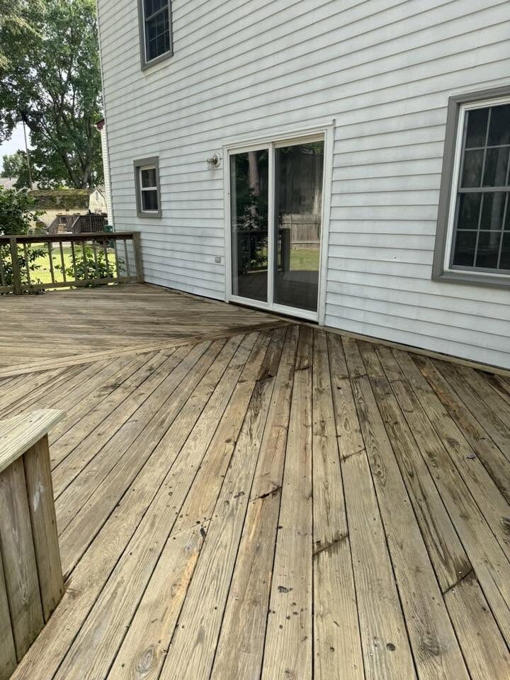 The same deck cleaned back to fresh golden wood grain