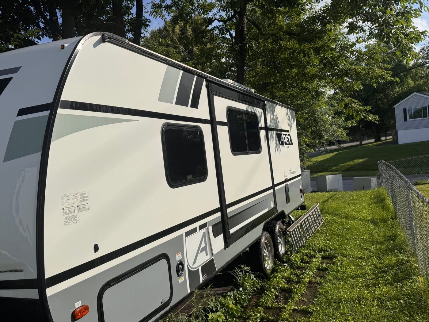 White travel trailer washed clean along its full side panel